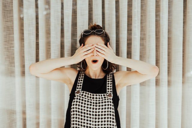 Woman covering eyes