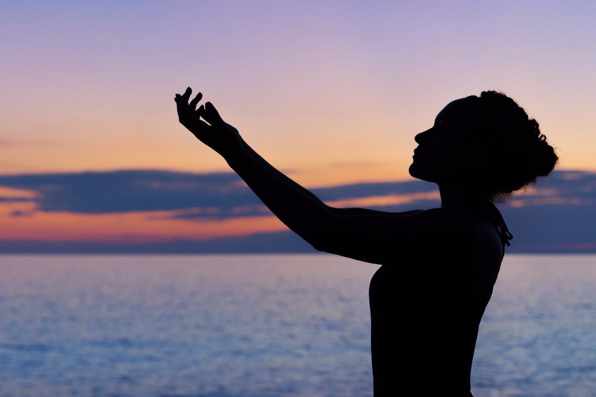 woman prayering sea
